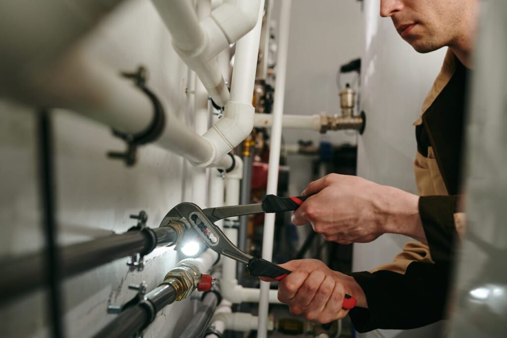Plumbers maintaining commercial plumbing pipes in Gilroy