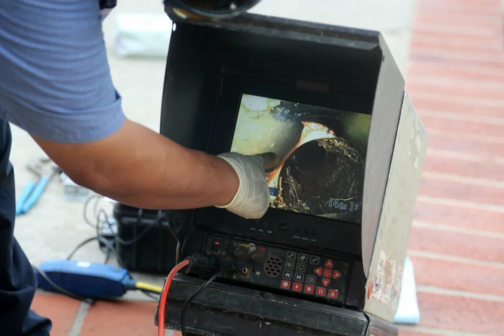 Technician viewing a drain inspection camera in Gilroy