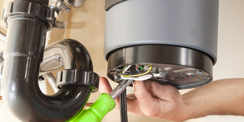 Technician repairing the heating element of a water heater in Gilroy